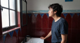 A Tiny Bathroom Went From Grimy To Cozy After A "Gothic-Aquatic" Redo